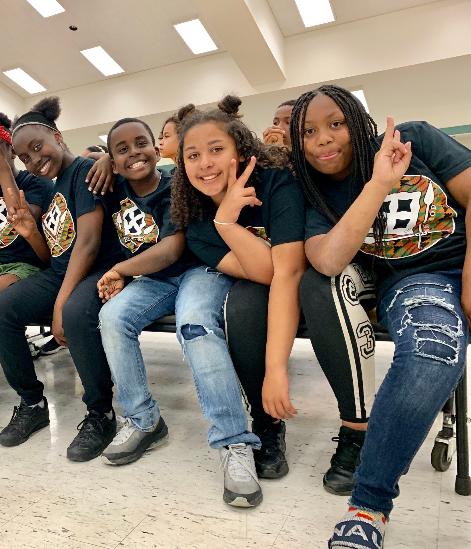Scholars sitting together, smiling